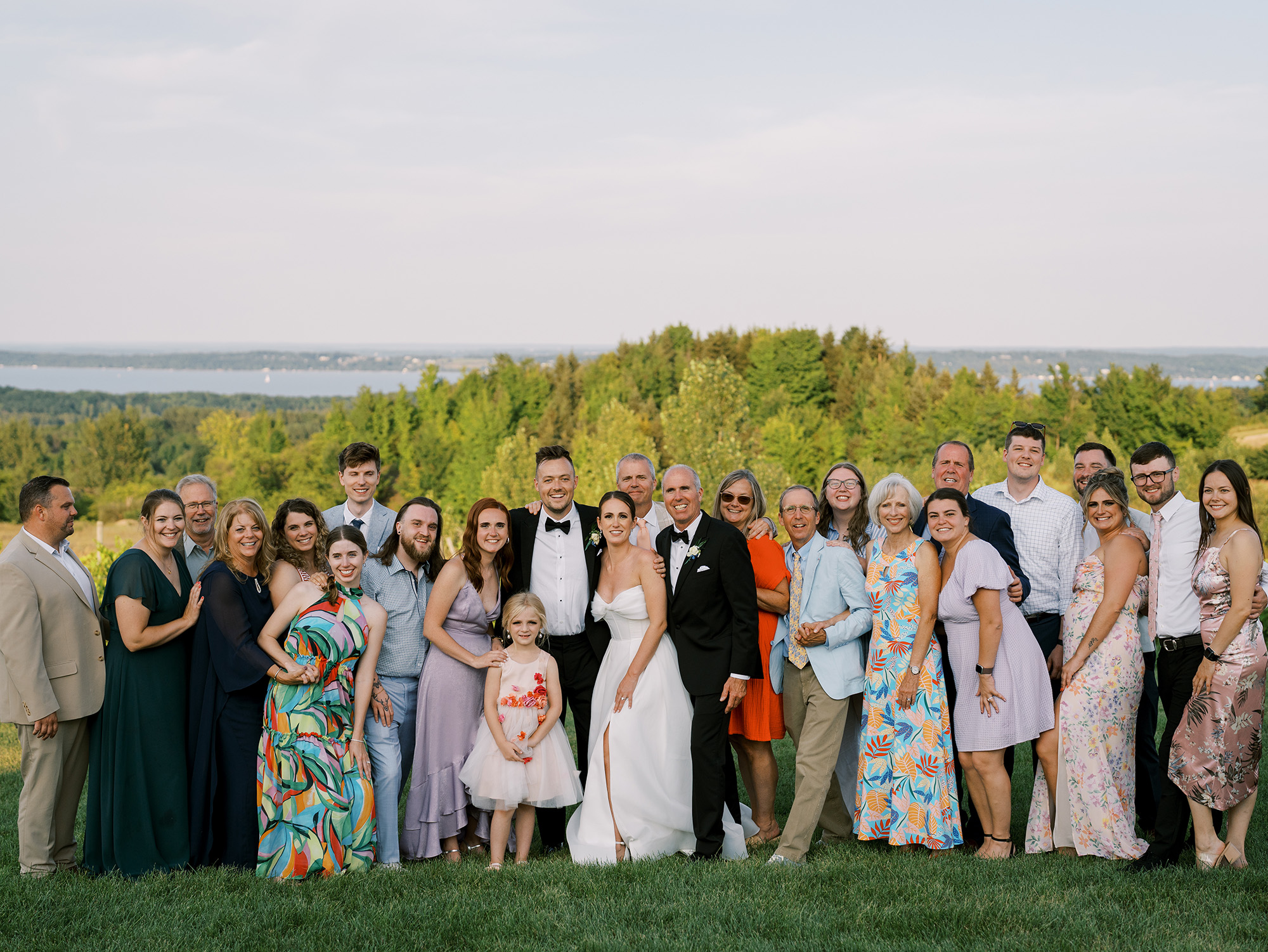 Family photo with water in background for Abby & Jake's Bay View Wedding