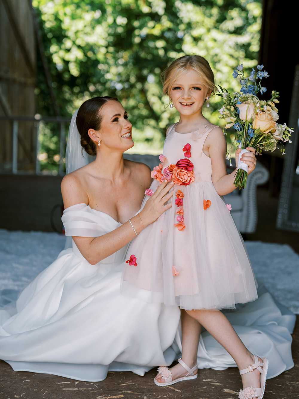 Bride and flower girl getting ready for Bay View wedding