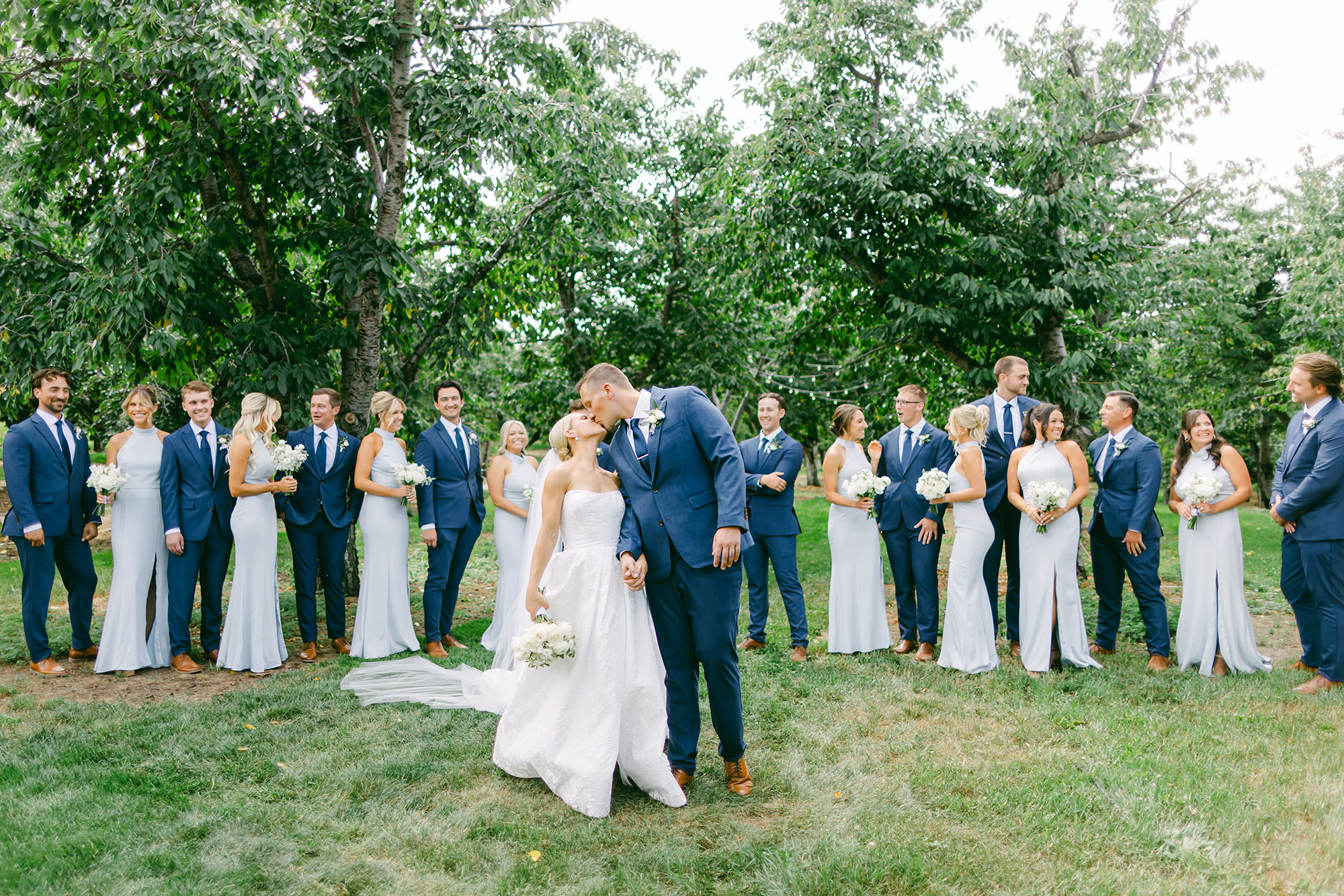 meg & randy kissing at bay view wedding with bridal party